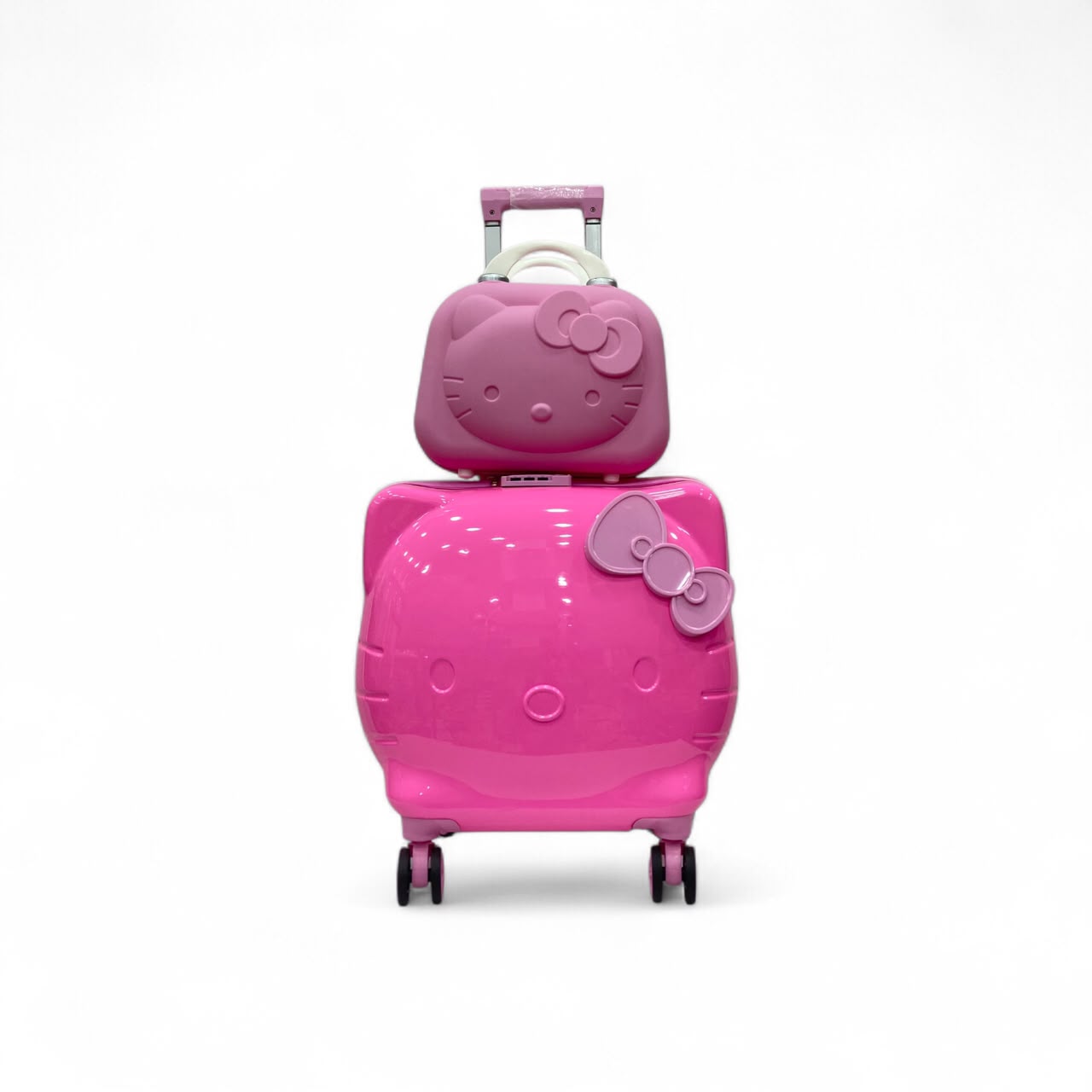 Hello Kitty hot pink luggage set showing shaped vanity case and spinner luggage